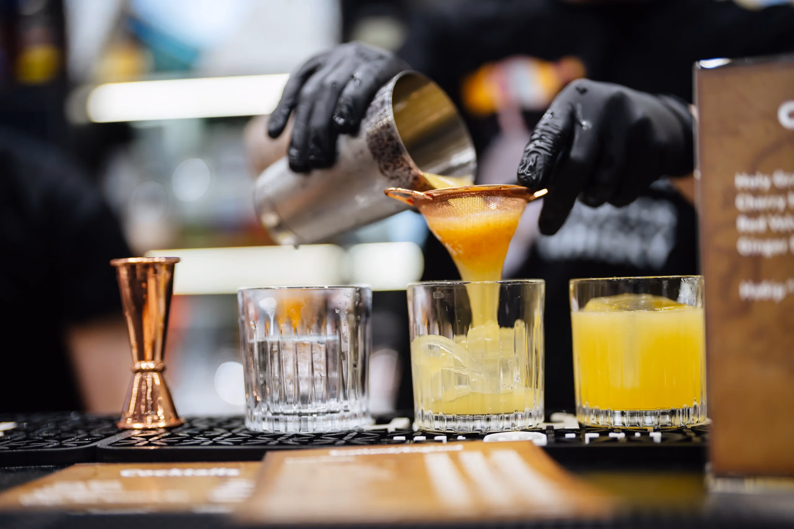 Skilled mixologist creates refreshing drinks busy nightlife setting