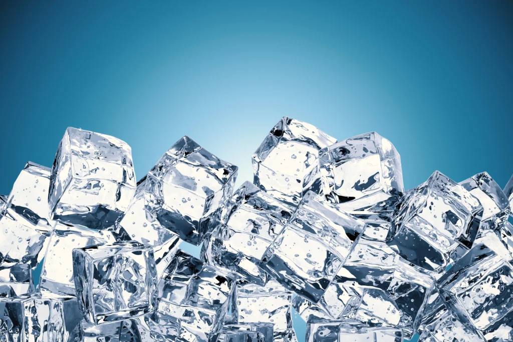 Heap of ice cubes with blank space blue background